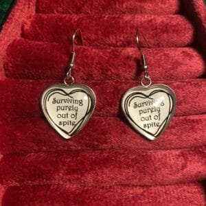 Surviving purely out of spite earrings